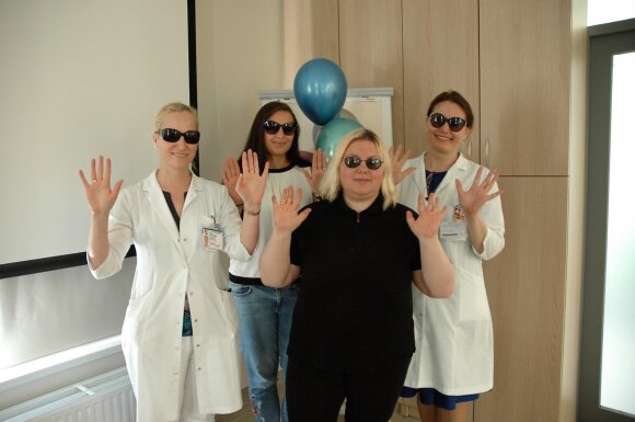   Vida Jočienė (in the middle) with doctors 