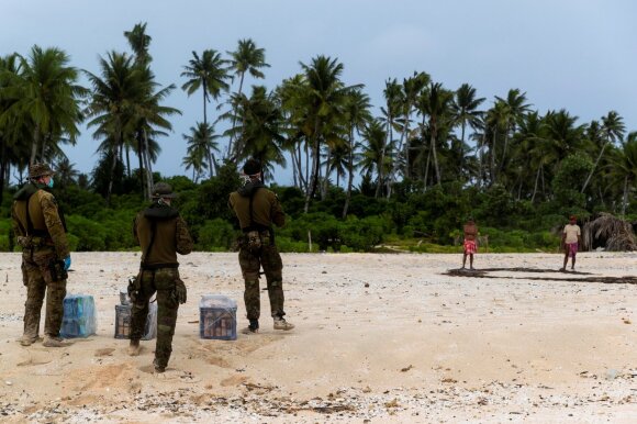 Sailors trapped on a rescued tropical island after writing the SOS signal in the sand