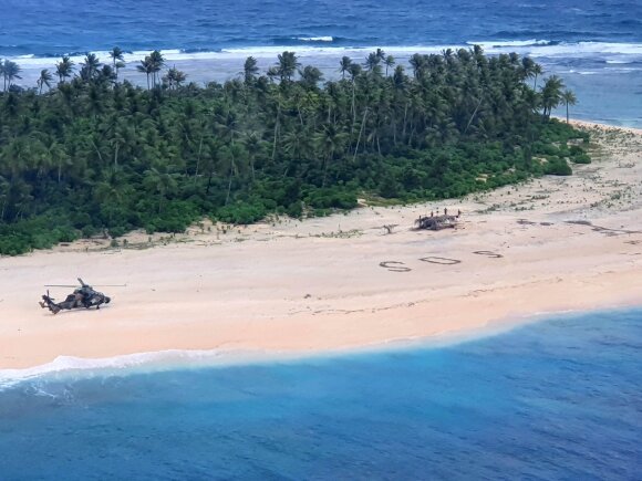 Sailors trapped on a rescued tropical island after writing the SOS signal in the sand