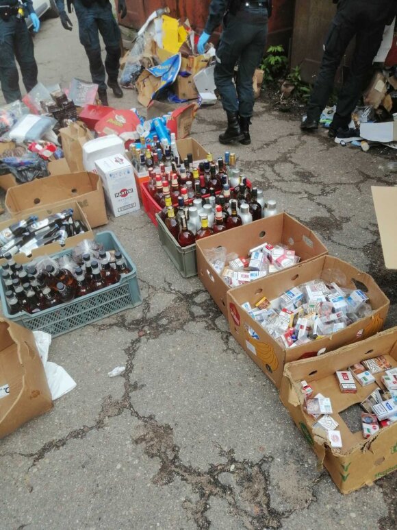 Both cigarettes and alcohol were found in the garbage-filled garage.